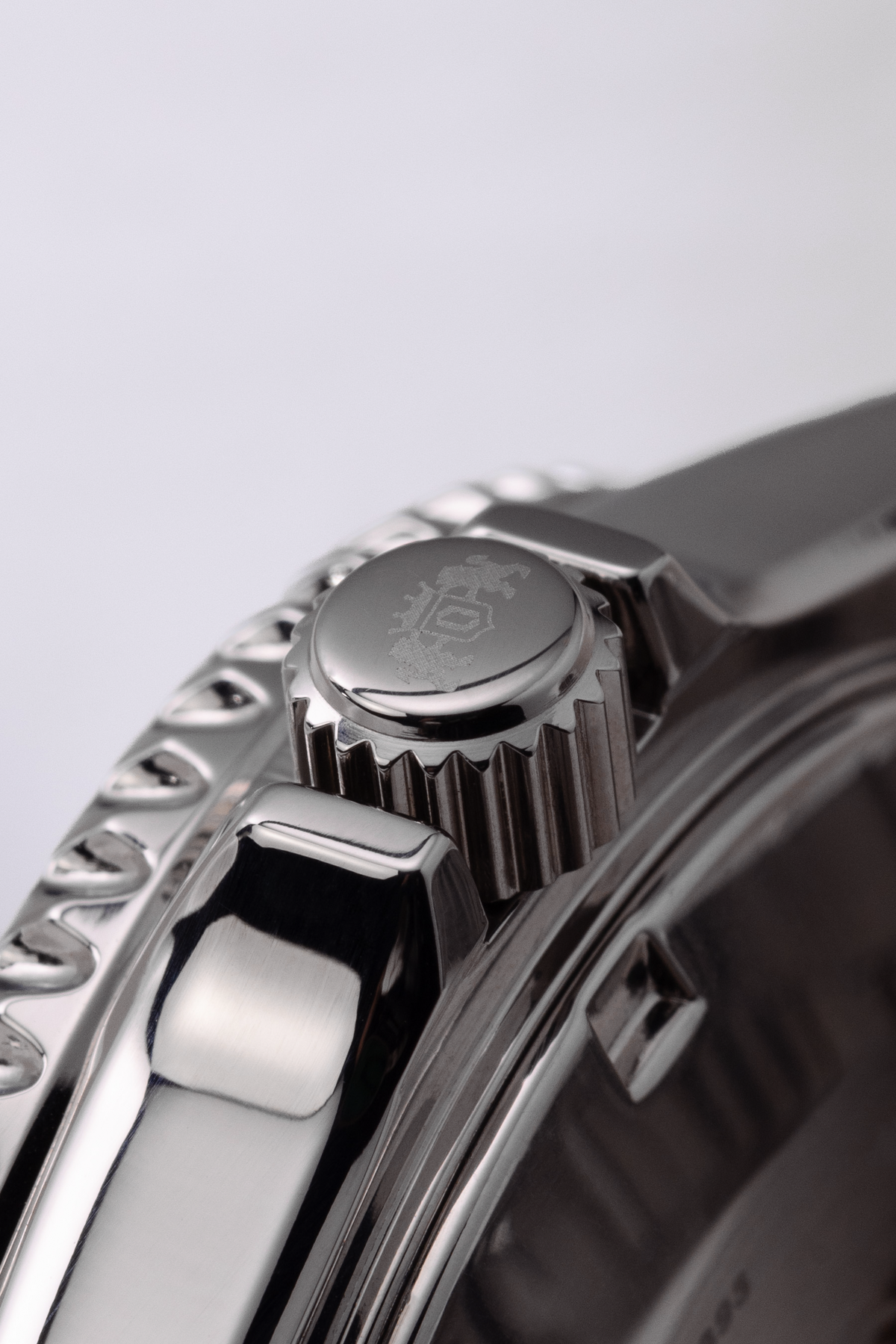 Orient stainless steel watch showing closeup of stamped crown.

Orient Kamasu RA-AA0001B39B