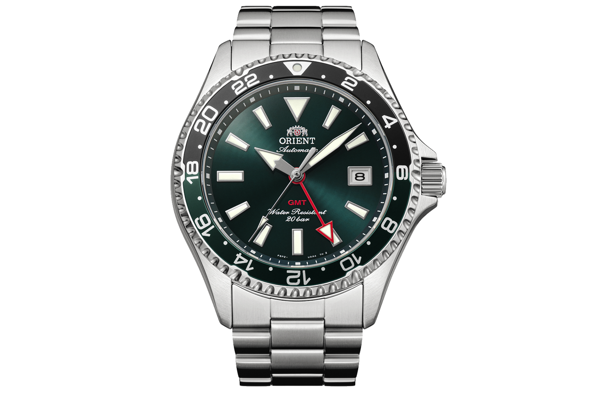 Orient RA-BC0002E Kamsu GMT watch with a green dial, black-and-green 24-hour bezel, date window, and stainless steel bracelet.