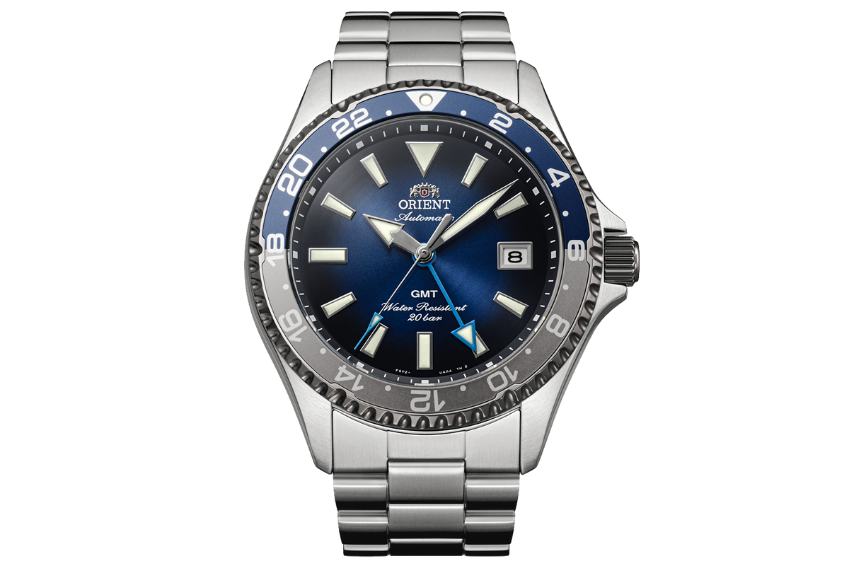 Orient RA-BC0005L Kamasu GMT watch with a blue gradient dial, blue-and-gray 24-hour bezel, date window, and stainless steel bracelet.